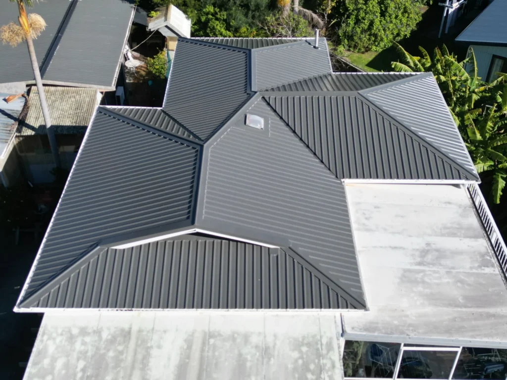 Long Run Roofing Profiles Explained for Auckland Homes 1 Aerial view of a long run metal re-roof completed by HDK on the Hibiscus Coast, Auckland, showing the ribbed roof profile